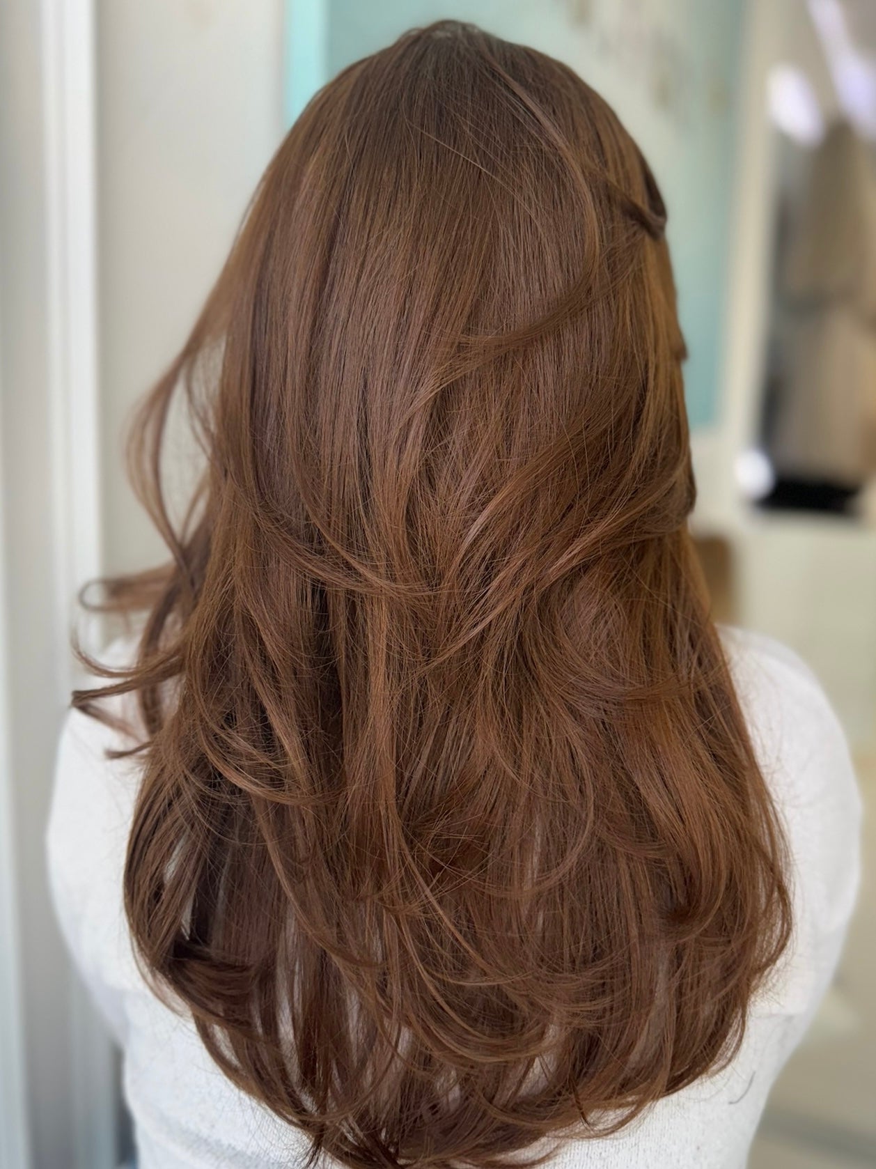 Autumn lace top wig, 24 inches in ginger brown, with pre-cut lace for a flawless natural look, styled in elegant waves.