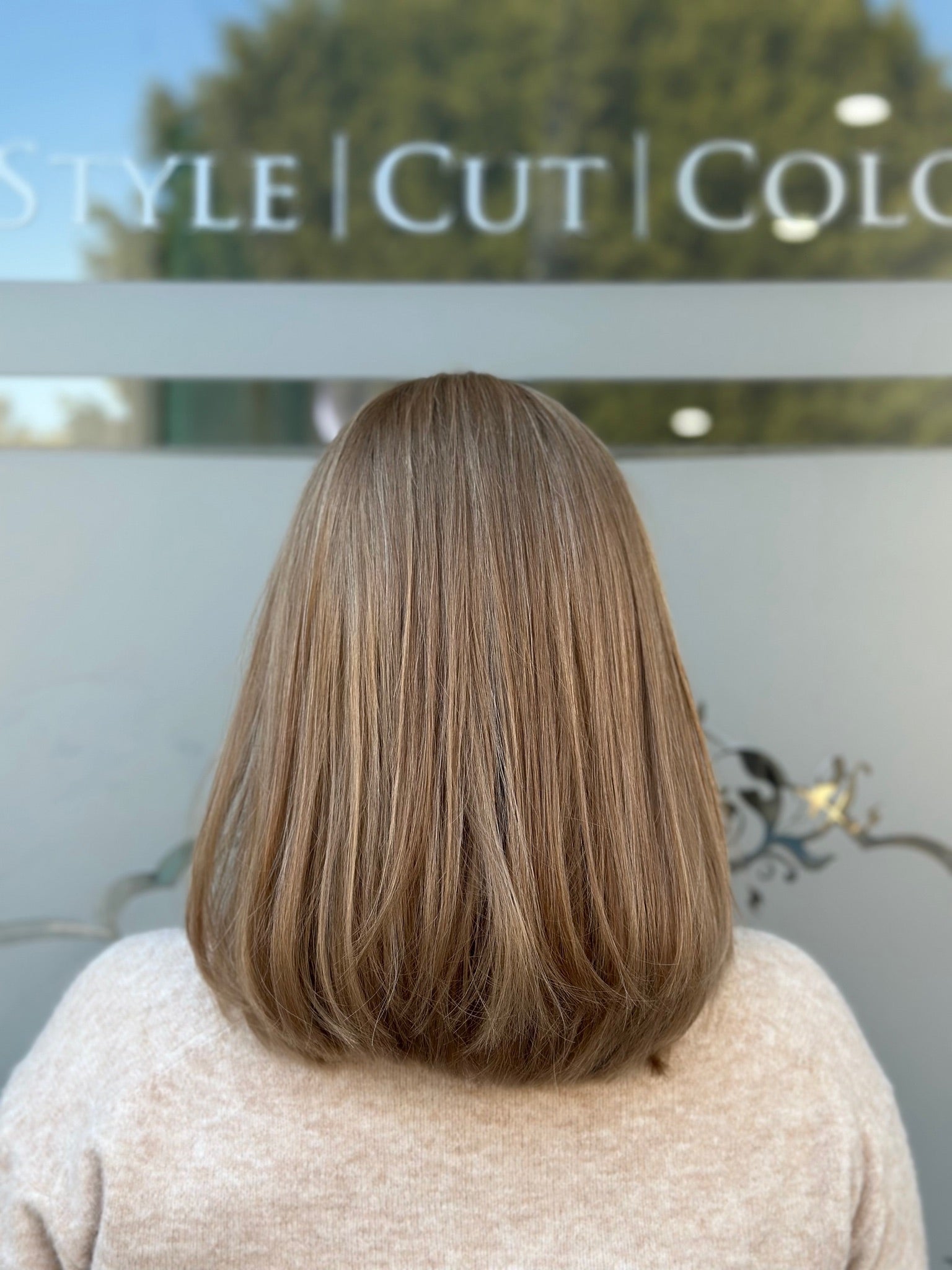 Carrie 18-inch lace top wig in blonde, featuring a lightweight bob style with soft layers and flawless lace for a natural, polished finish.