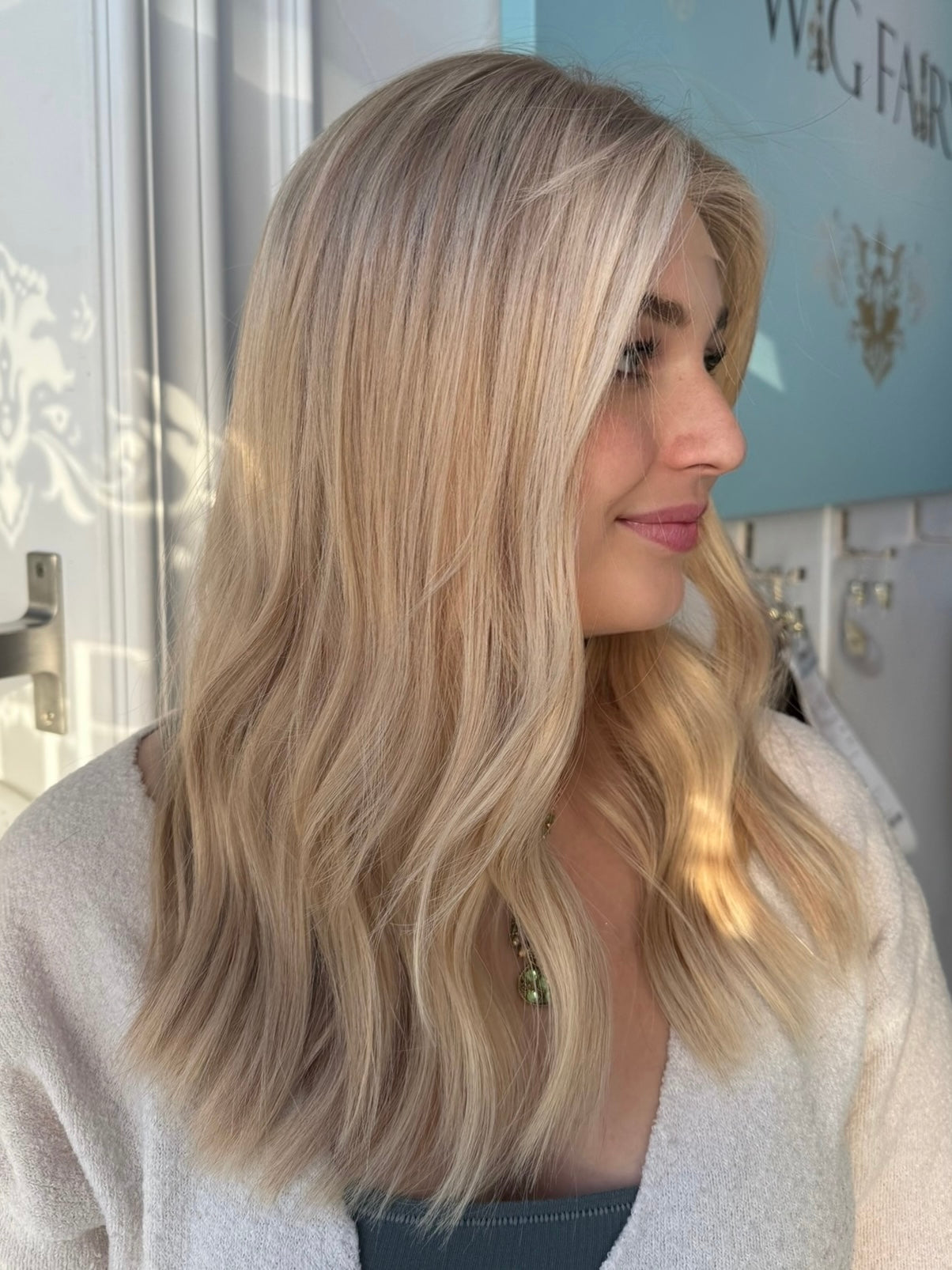 Daisy 20-inch lace top wig in blonde, featuring natural waves and a flawless lace finish for a chic, seamless look.