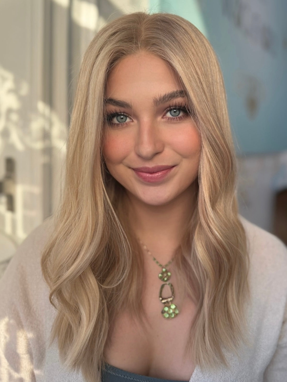 Daisy lace top wig, 20 inches in blonde, styled in soft waves for a flawless, natural look with pre-cut lace for a seamless fit.