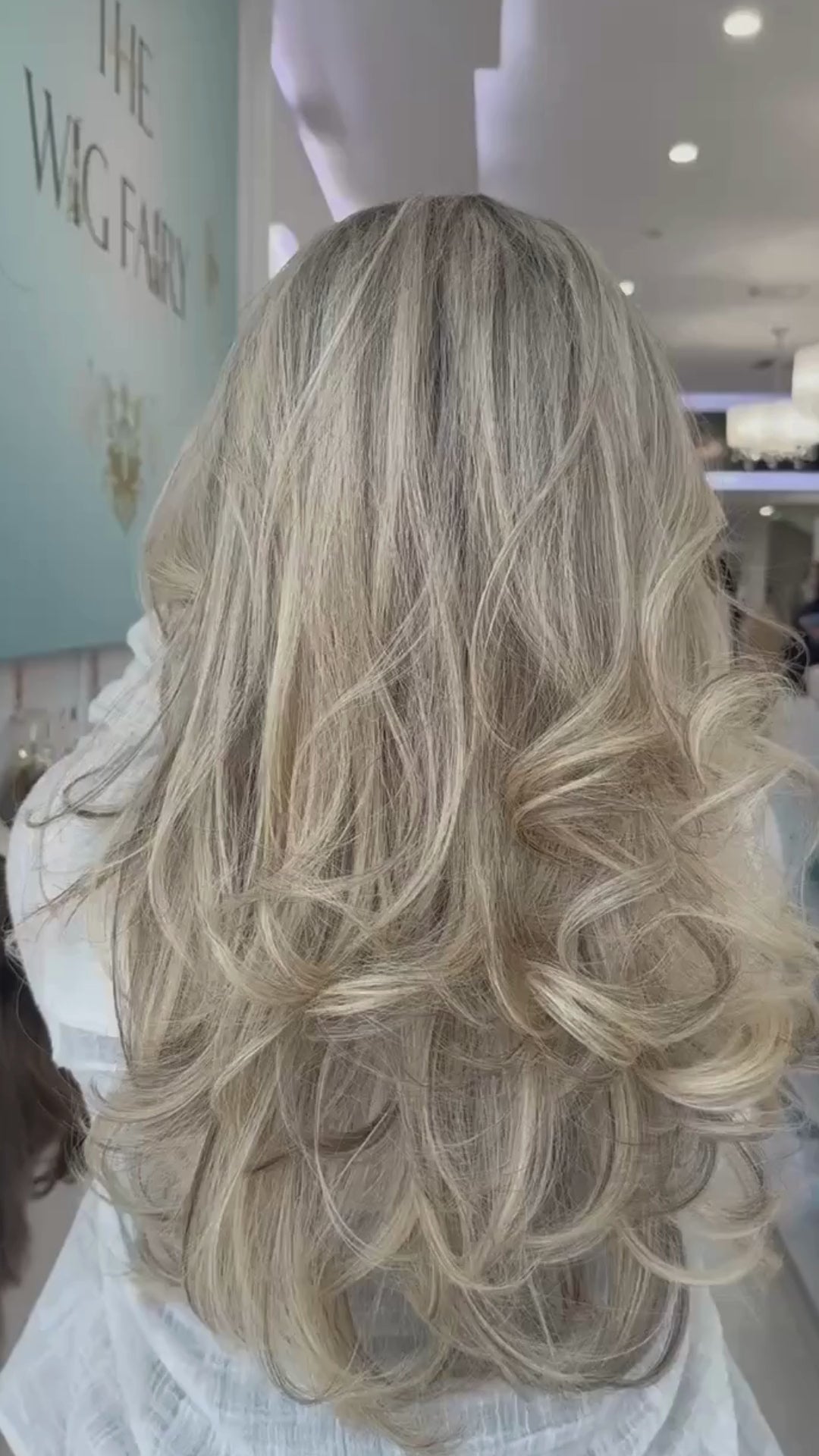 Blonde bombshell wig with voluminous layers and a radiant, golden tone for a bold, glamorous look.