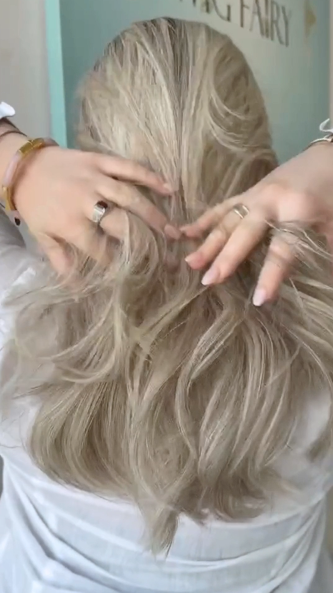 Video of a short wig in cool ashy blonde with soft waves, showing off its textured layers and natural flow.