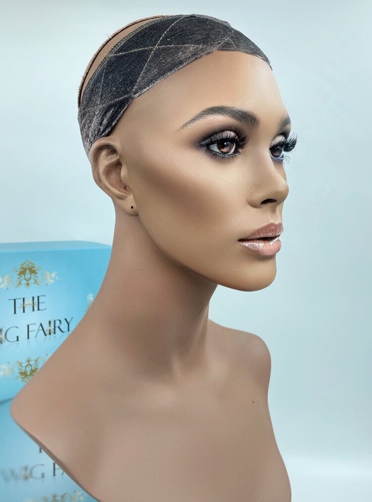 Mannequin wearing The Wig Fairy Wig Grip Band in dark brown velvet with crisscross stitching, designed for secure wig placement without adhesives.