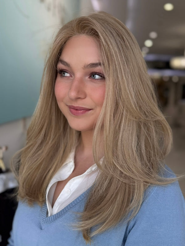  Side view of Charlotte wig, 20-inch straight human hair in a soft beige blonde tone, styled for natural volume.