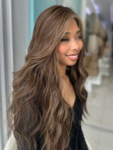 Angled view of Sasha human hair wig, highlighting soft texture and warm brown dimension.