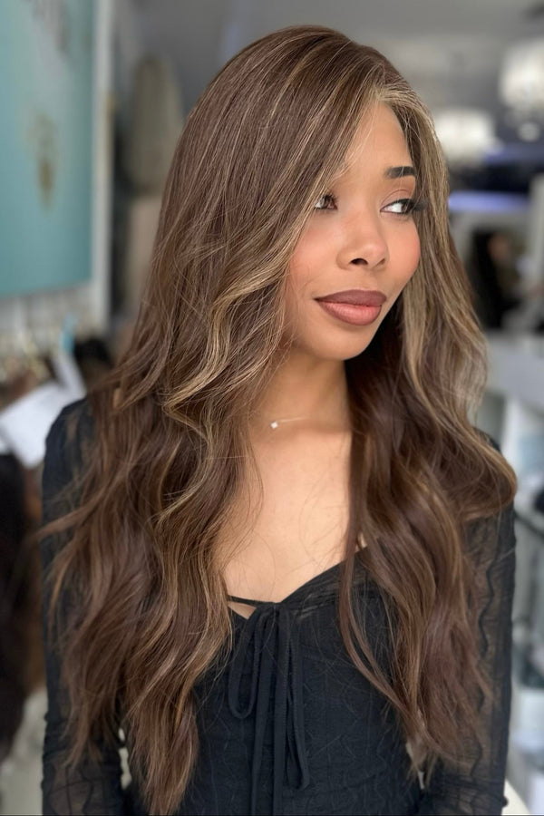 Side view of Sasha wig showing 26 inches of soft waves and blended espresso brown and chestnut tones.