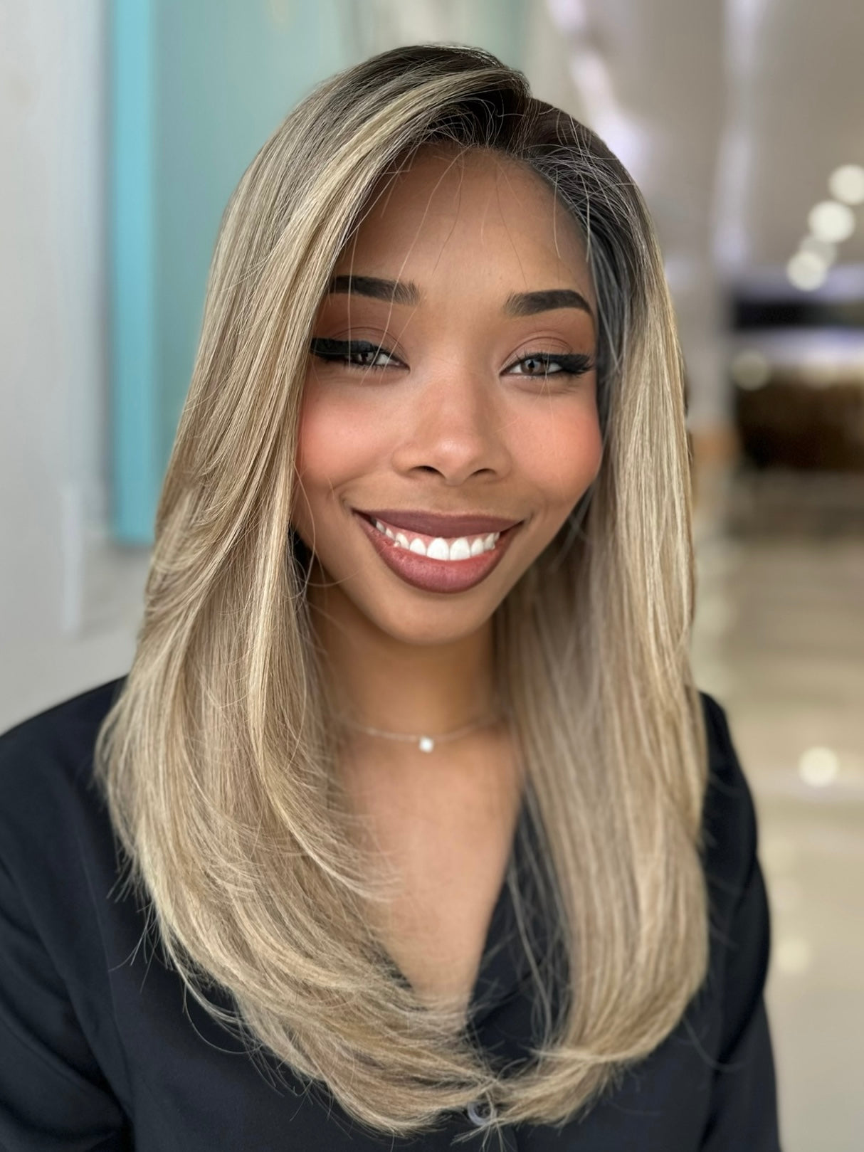 Sky wig with a beautiful light brown to blonde balayage, 20 inches long, offering a smooth and sleek finish. Pre-cut lace for a natural appearance.