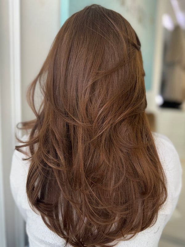 Autumn lace top wig, 24 inches in ginger brown, with pre-cut lace for a flawless natural look, styled in elegant waves.