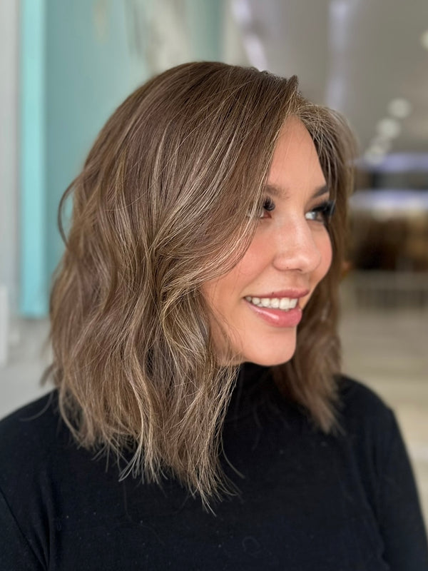 Angled view of Camila wig in 15-inch length, featuring a soft layered cut and pre-cut lace fron