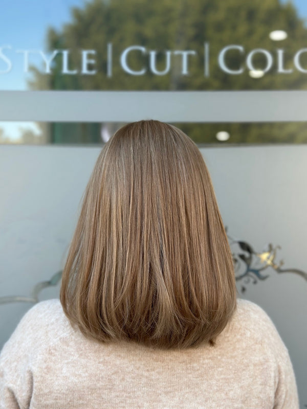 Carrie 18-inch lace top wig in blonde, featuring a lightweight bob style with soft layers and flawless lace for a natural, polished finish.