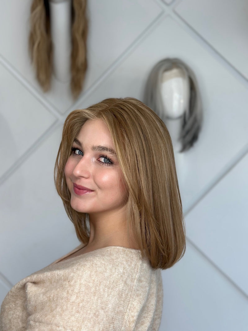 Carrie lace top wig, 18 inches in blonde, with pre-cut lace for a flawless, natural look, styled in a fun, flirty bob cut.