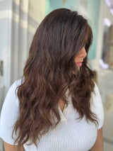 Gabriella 24-inch lace top wig in dark brown with natural waves, offering a seamless, voluminous look with flawless lace for a natural finish.