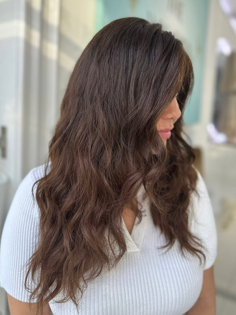 Gabriella 24-inch lace top wig in dark brown with natural waves, offering a seamless, voluminous look with flawless lace for a natural finish.