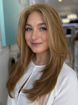 Front angled view of a model wearing the Georgia wig – brunette blend in #8/14, styled in soft layers.