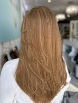 Back view of the Georgia wig in color #8/14 – long, layered brunette with a natural finish, 24 inches.