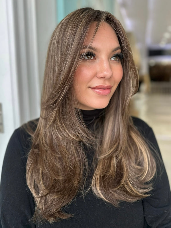 Luxury wig Gracie 22 inches in warm chestnut brown with golden blonde highlights, shown from the front view with soft face framing layers