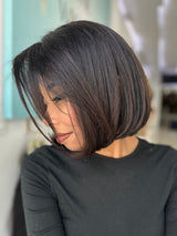 Ivonne lace top wig, 18 inches in black, with pre-cut lace for a flawless natural look, styled in a sleek and polished bob.
