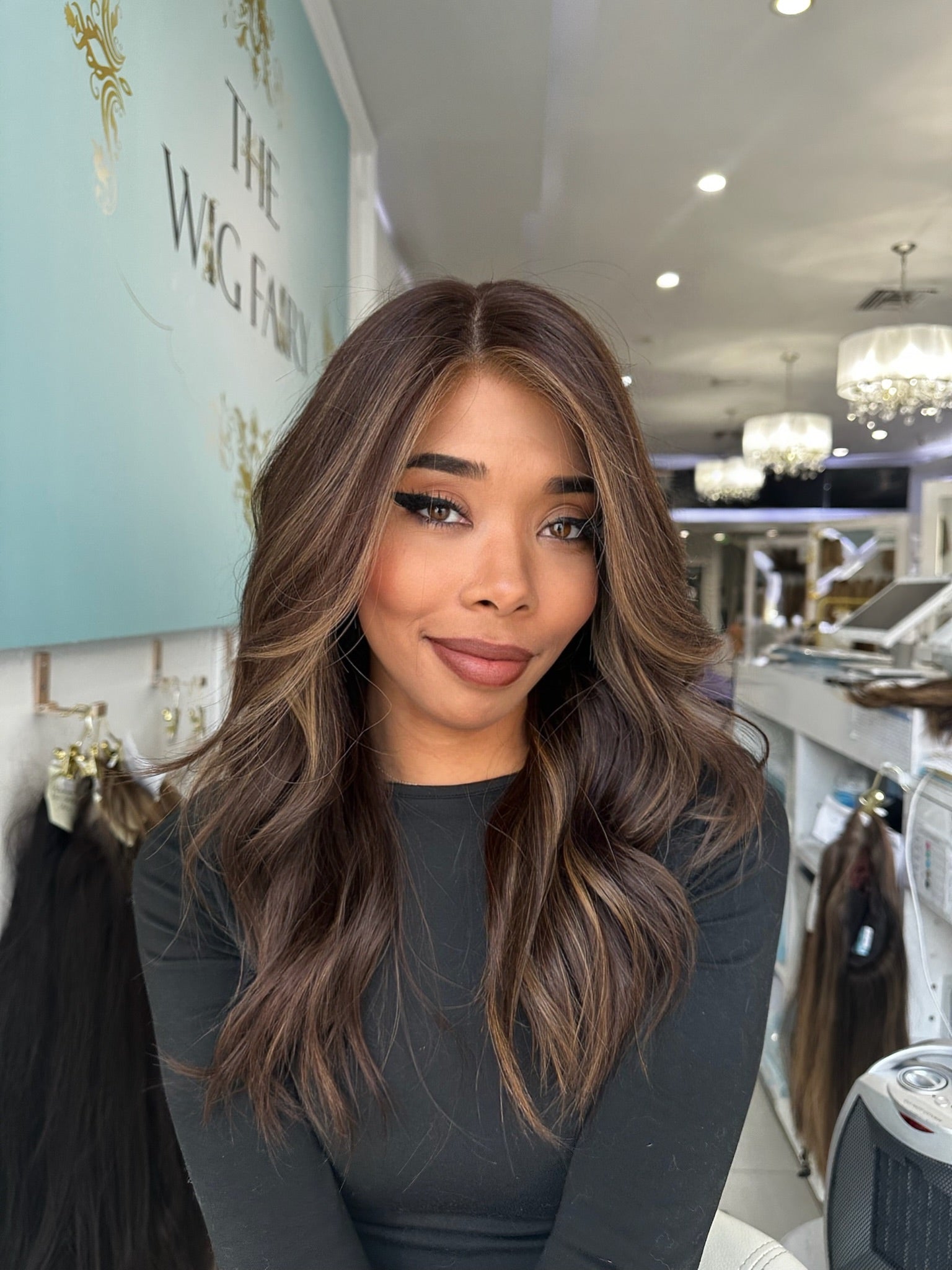Jada lace top wig, 22 inches in rich brown with warm caramel highlights, styled in soft waves for a flawless, natural look with pre-cut lace for seamless wear.