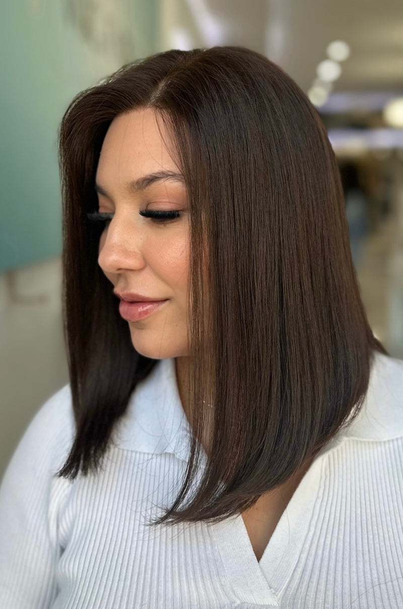 Julia 15-inch lace top wig in dark brown, offering a smooth, polished style with flawless lace for a seamless, natural finish.