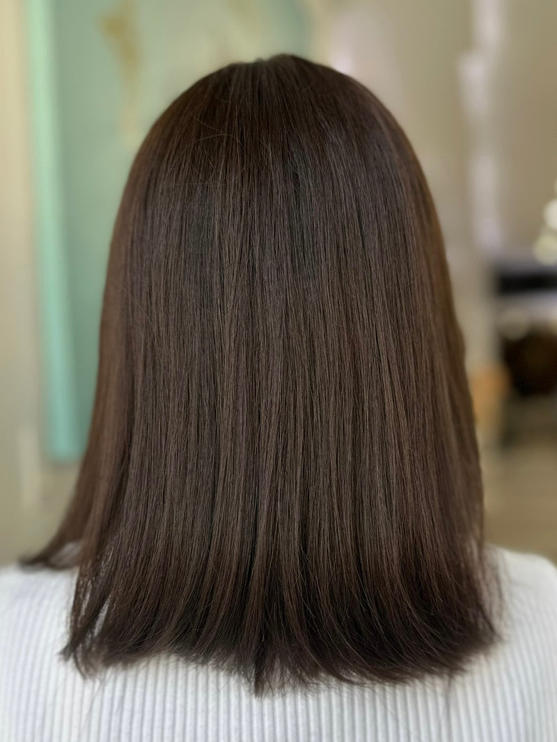 Julia lace top wig, 15 inches in dark brown, with pre-cut lace for a flawless natural look, styled in a chic, straight bob.