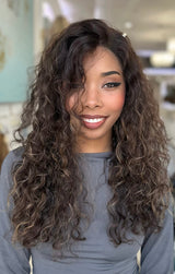Marissa wig by The Wig Fairy - a long, brown curly human hair wig with natural highlights, offering a voluminous and elegant look.