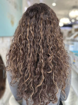 Marissa wig by The Wig Fairy, a luxurious long-layered, brown and curly human hair wig, designed for a soft, bouncy, and effortlessly stylish look.