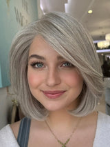  Misty lace top wig, 14 inches in platinum grey, styled in a sleek bob cut for a flawless, natural look with pre-cut lace for easy wear.