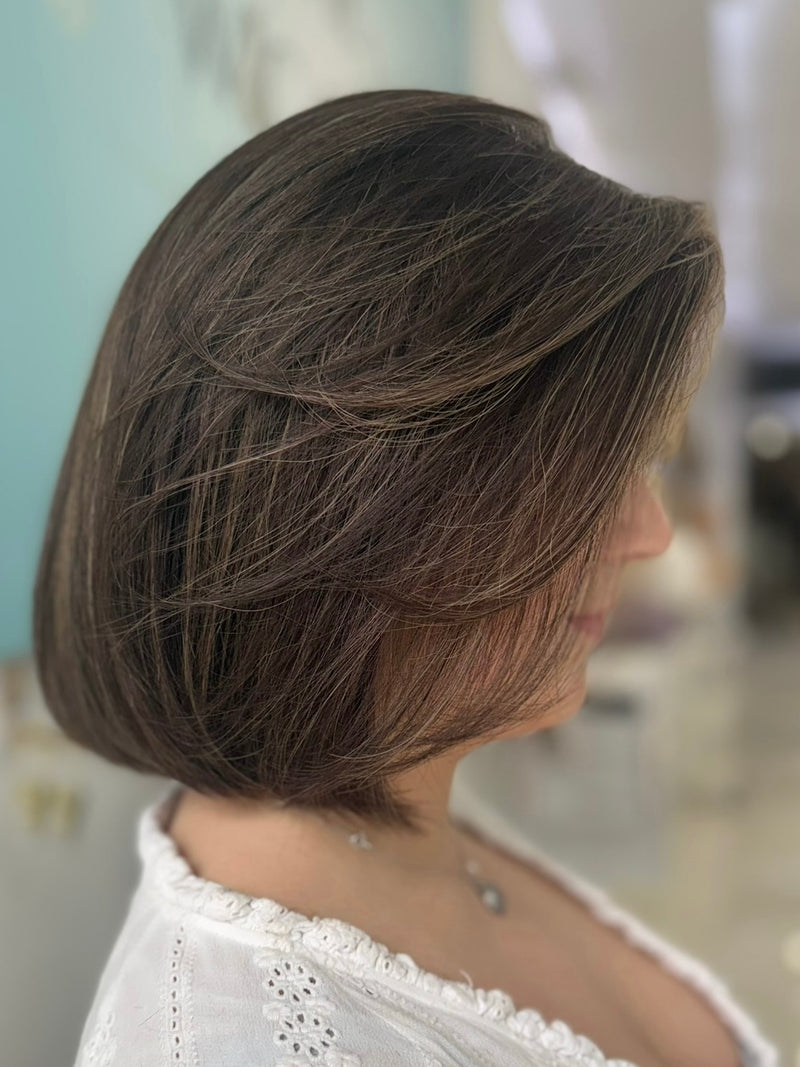 Noelle 16-inch lace top wig in dark brown with highlights, featuring a smooth bob cut and flawless lace for a natural, seamless finish.