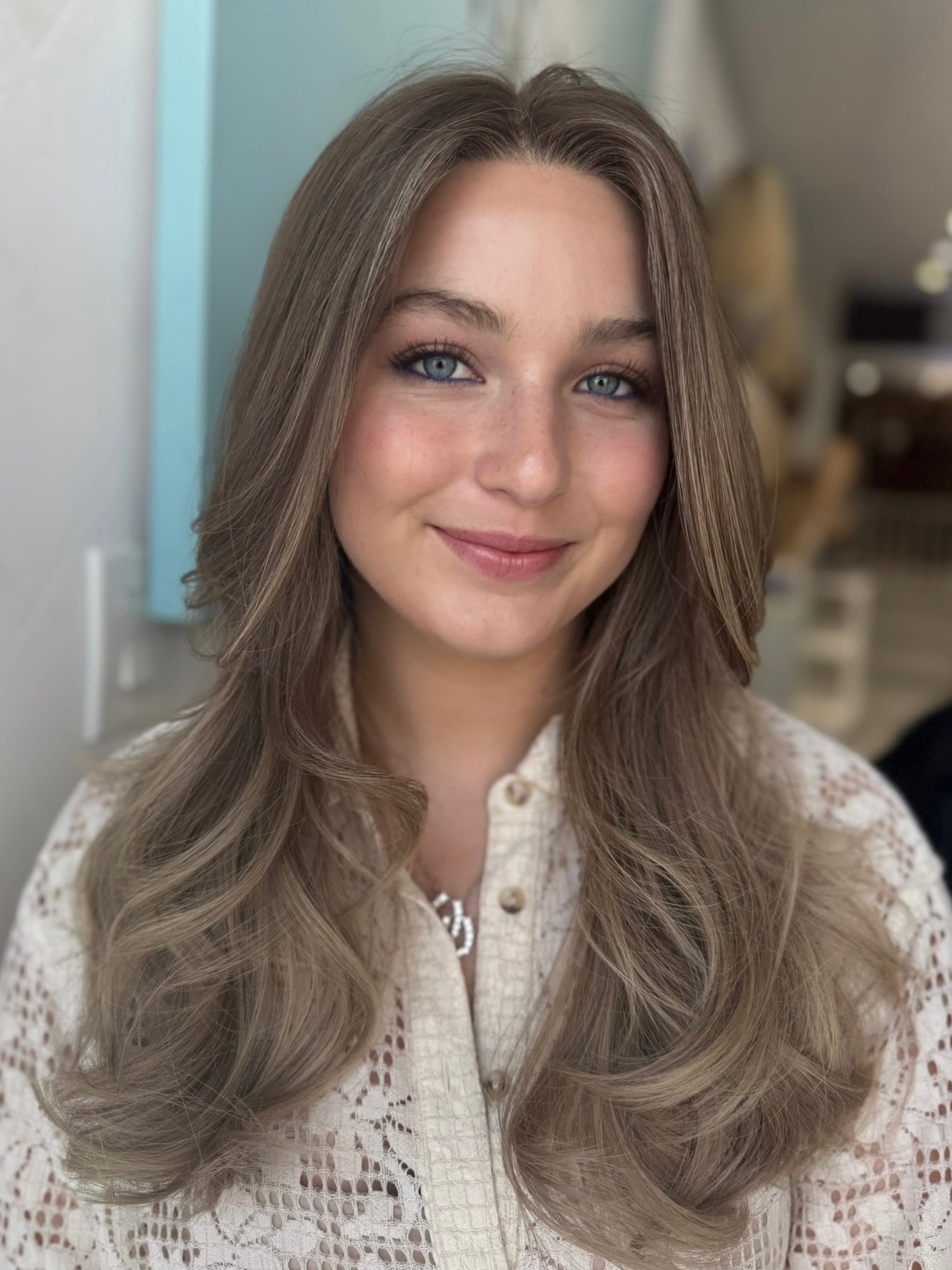 Nora lace top wig, 22 inches in light brown blonde, styled in soft waves for a flawless, natural look with pre-cut lace for easy wear.