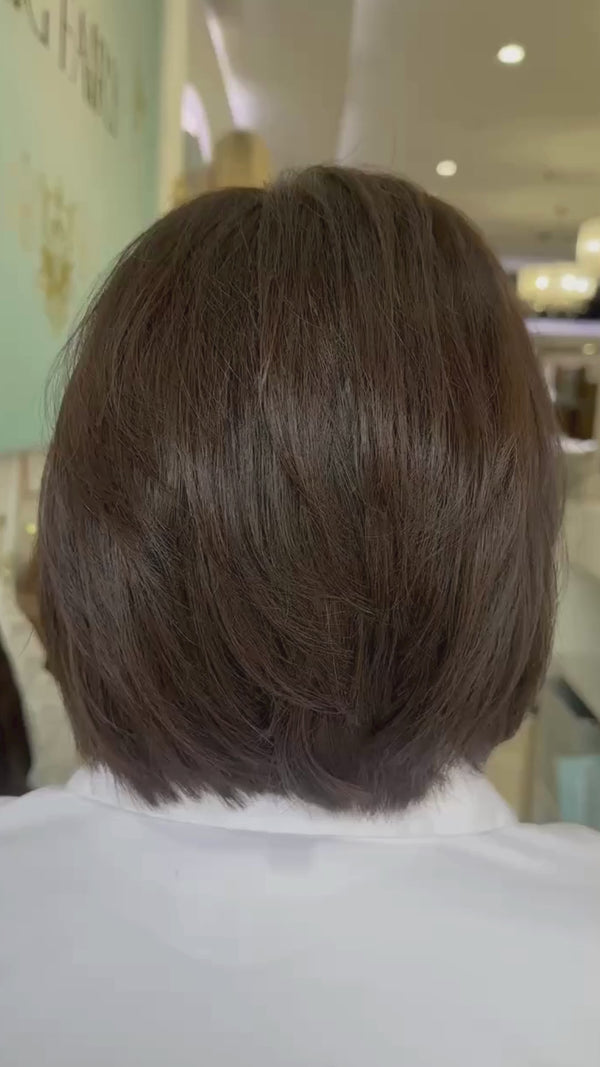 Chic short bob wig with a sleek finish and natural movement, offering a modern, effortless look.