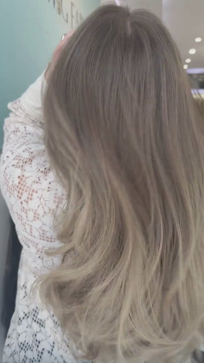 Long, luscious brown wig with warm highlights, featuring rich dimension and a silky, flowing finish.
