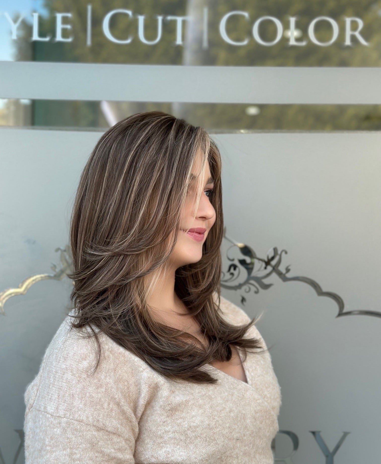 Rachel 22-inch lace top wig in blonde, styled in a chic bob with soft waves, offering a natural, polished finish with flawless lace.