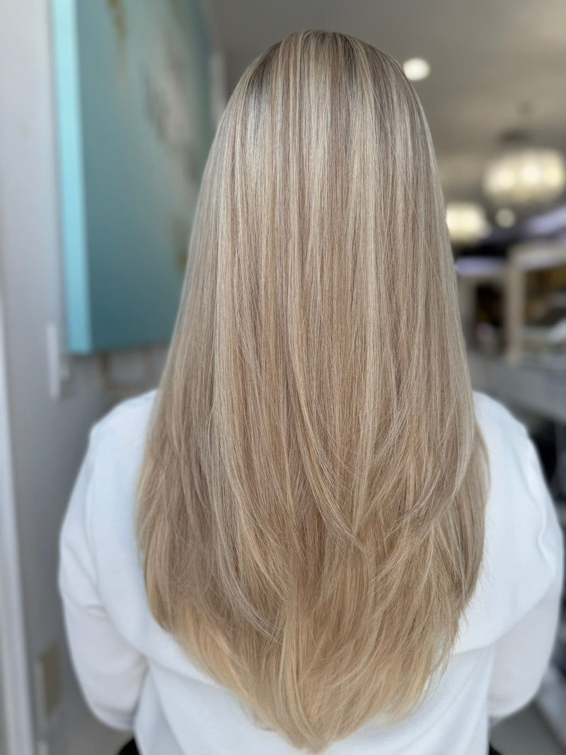 Back view of Roxanne wig showing soft, long layers and dimensional blonde color