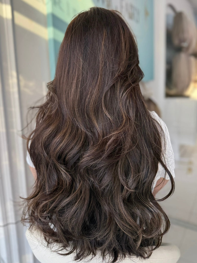 Ruby 30-inch lace top wig in dark brown, featuring long, voluminous layers for a stunning, natural finish with flawless lace for a seamless look.