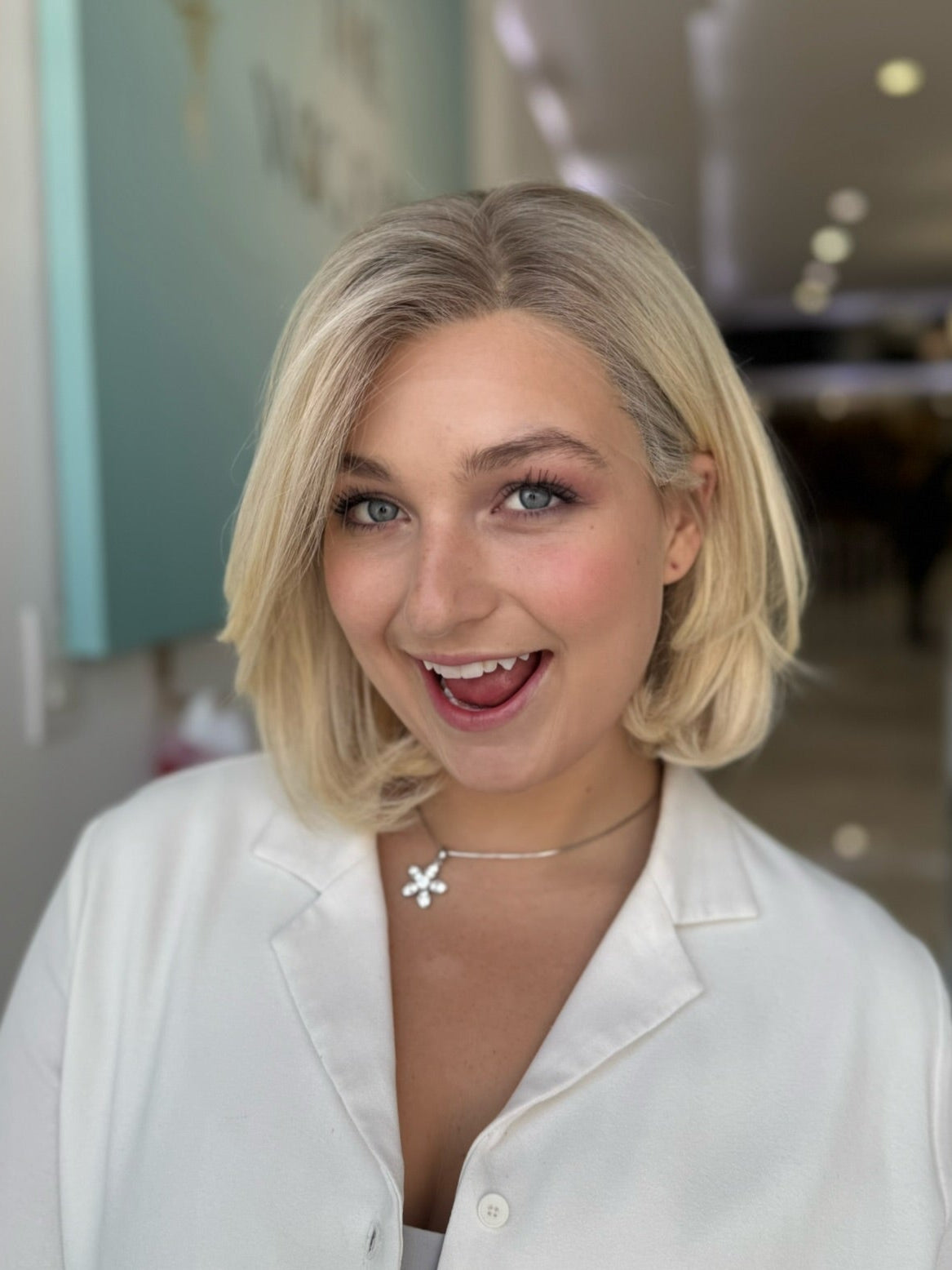 Model wearing 16-inch short blonde European lace top wig — front view