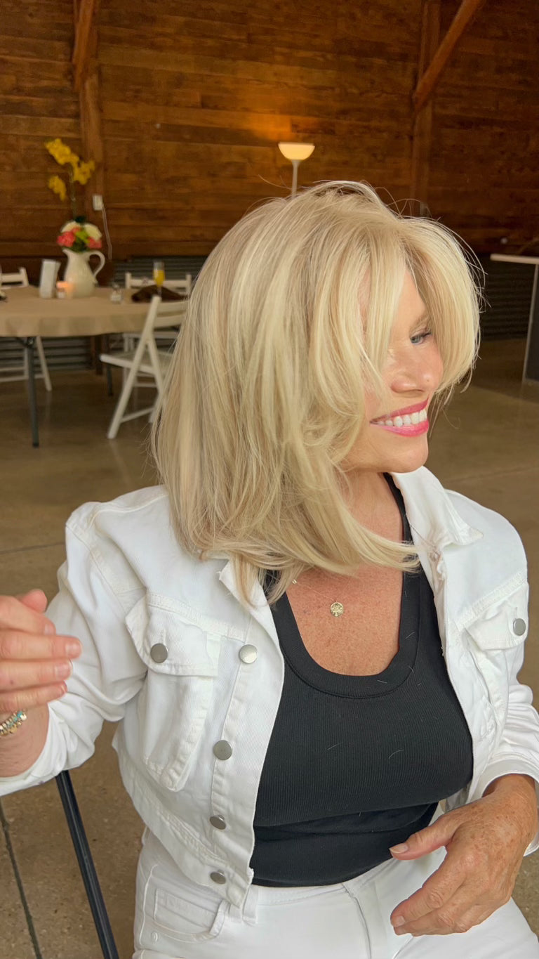 Viral 16-inch lace top wig in blonde, crafted from 100% European hair, providing a flawless, natural look with pre-cut lace for easy wear.