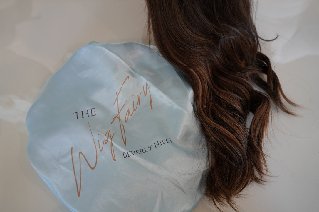 The Wig Fairy silk travel bag, designed for safe and stylish wig storage while traveling. Perfect for keeping your wig in pristine condition.
