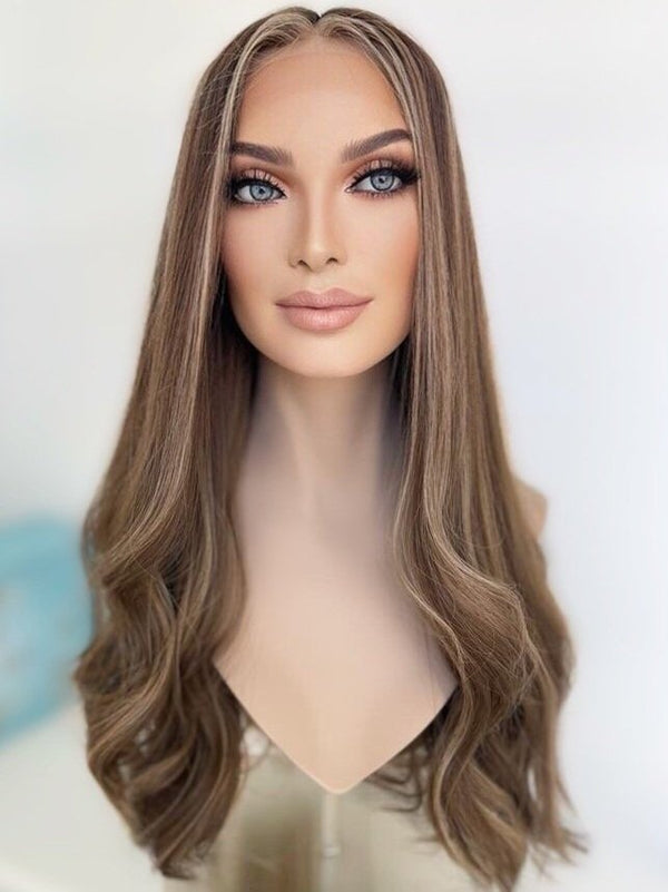 Back view of The Wig Fairy Anikka wig in a cool ash brunette blend with beige blonde highlights, styled in soft 26-inch waves