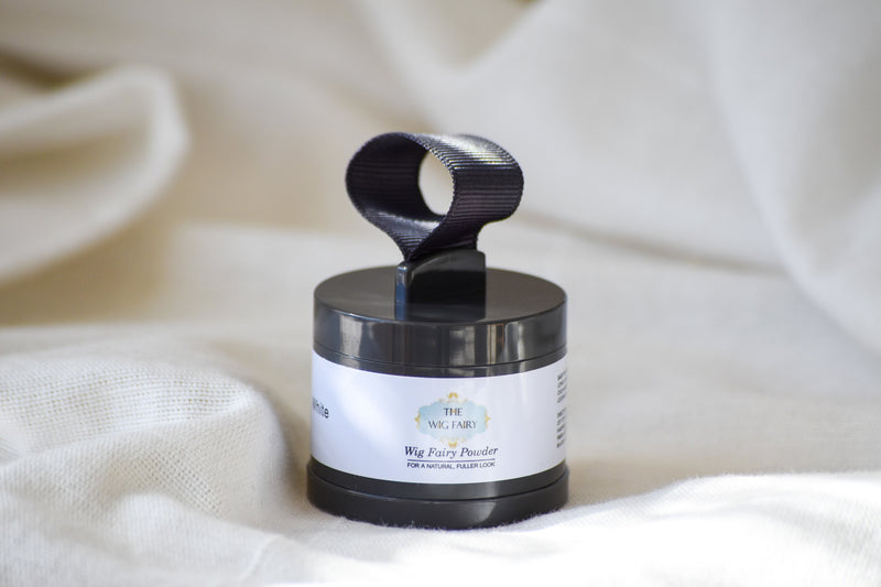 The Wig Fairy Powder in Brown with angled brush for precise application on wig roots