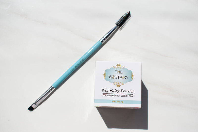 The Wig Fairy Powder in Brown with an angled brush for precise application on wig roots