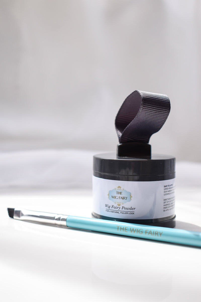 The Wig Fairy's Gray Fusion Powder for wigs, showing the powder in an angled view, highlighting the easy-to-use applicator.
