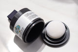 Detailed close-up of the lid of The Wig Fairy’s Gray Fusion Powder, showcasing the applicator and packaging design.