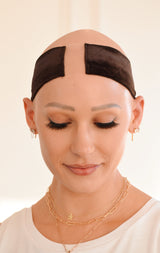 Front view of model wearing The Wig Fairy Wig Grip Band in beige velvet, highlighting breathable mesh and sleek, comfortable fit.